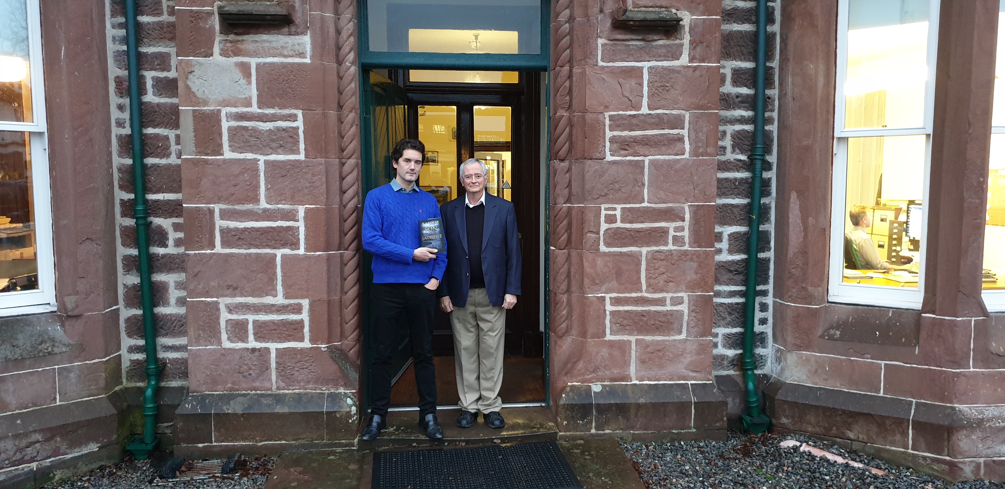 Terry Lovat presents his new book to Lord Lovat