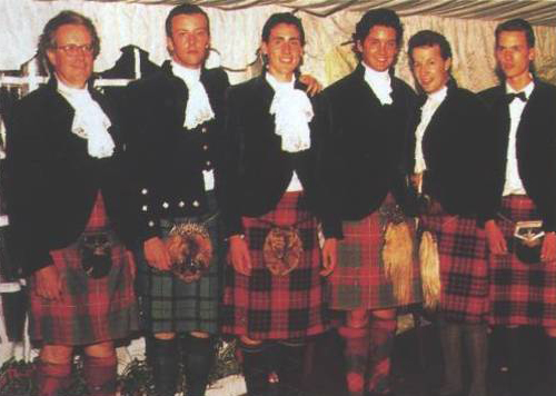 Lord Lovat with family members in Fraser tartan